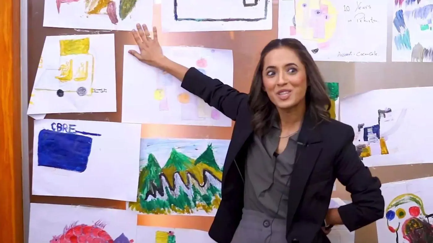 Sarah Mashhood leading a team through a wall of work