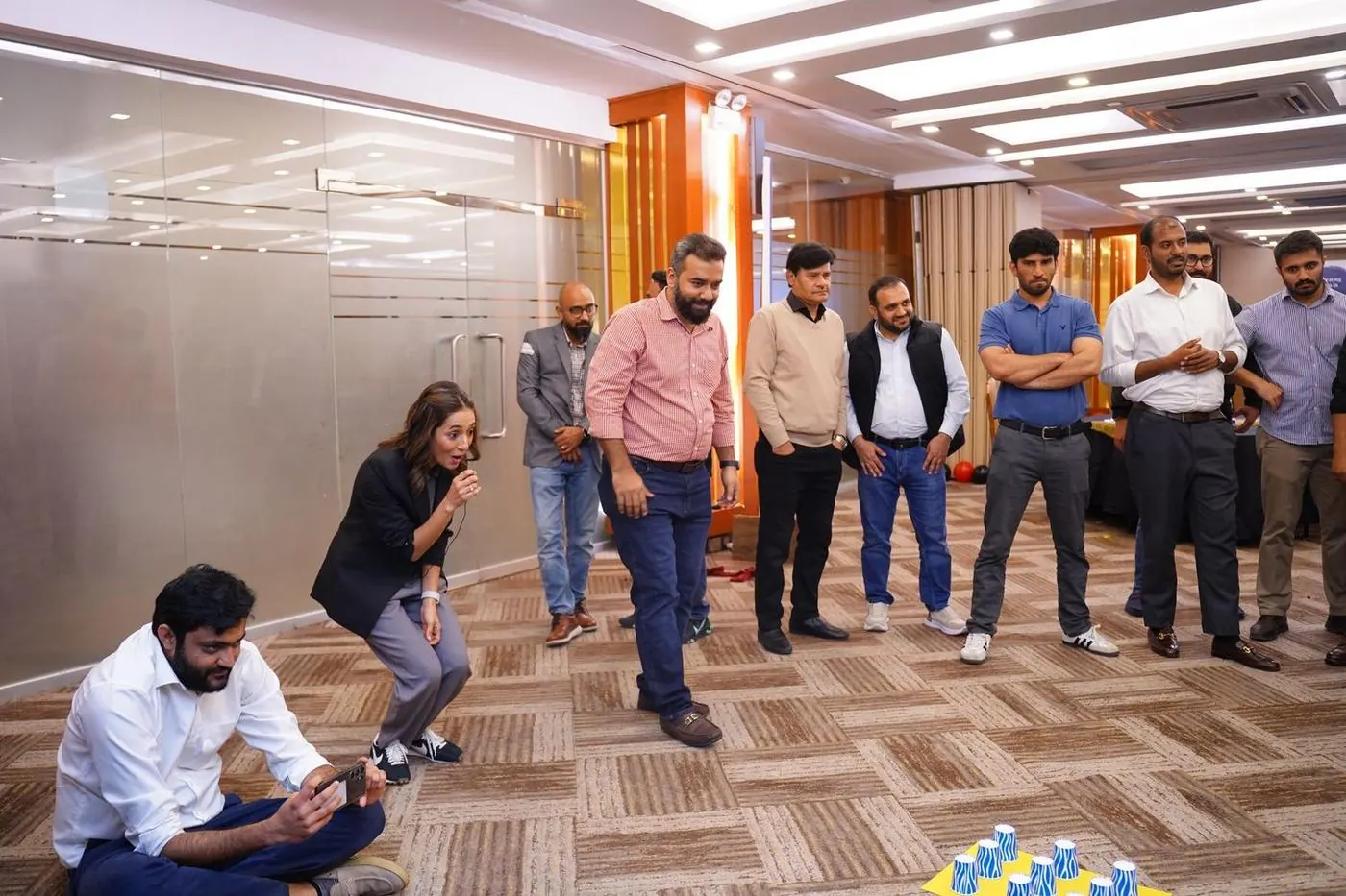 Sarah Mashhood down at the group's level on the office floor