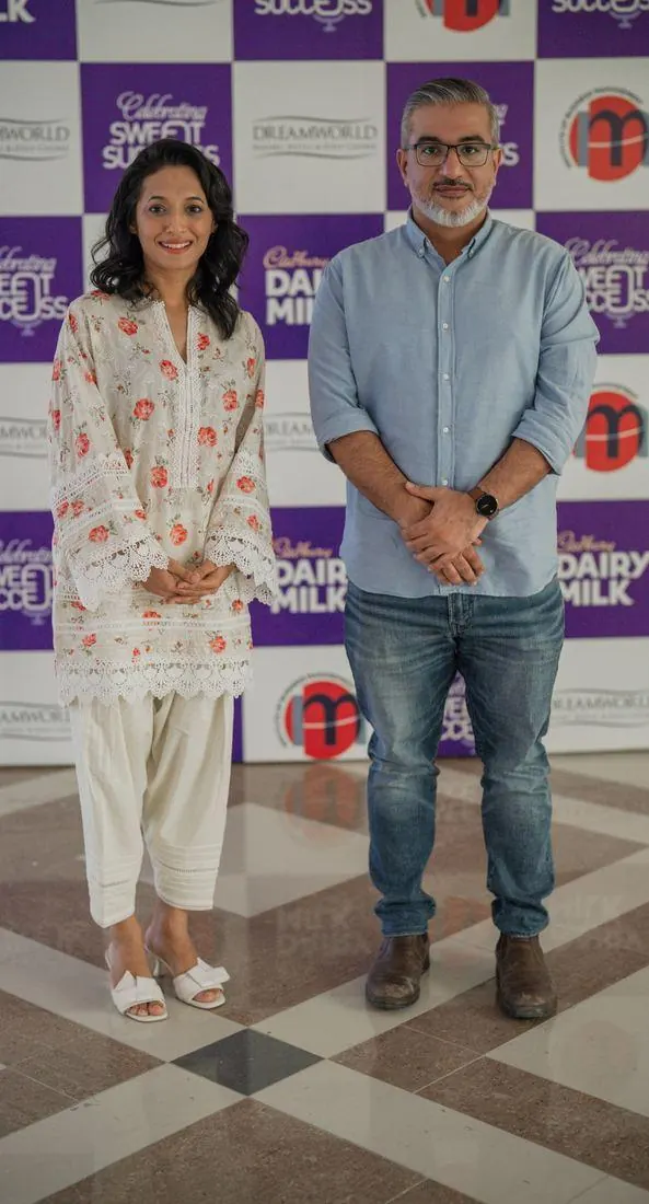 Sarah Mashhood with a guest at the sponsor wall